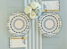 Load image into Gallery viewer, Decorative plates with floral arrangement and cutlery on a striped background
