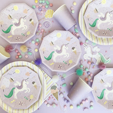 Load image into Gallery viewer, Unicorn-themed party supplies including plates and cups on a light background