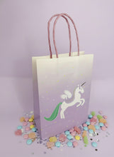 Load image into Gallery viewer, Gift bag with a unicorn design on a light purple background
